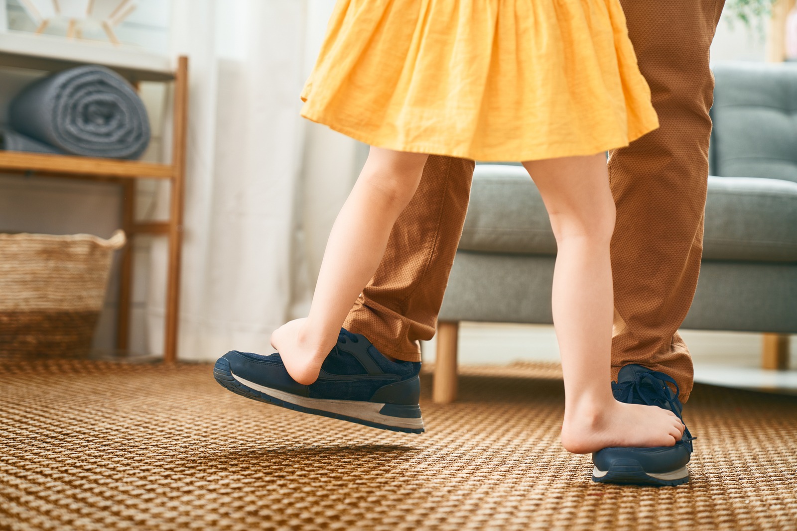 stepchildren need to be provided for explicitly in estate planning documents, little girl standing on her daddy's feet while they dance
